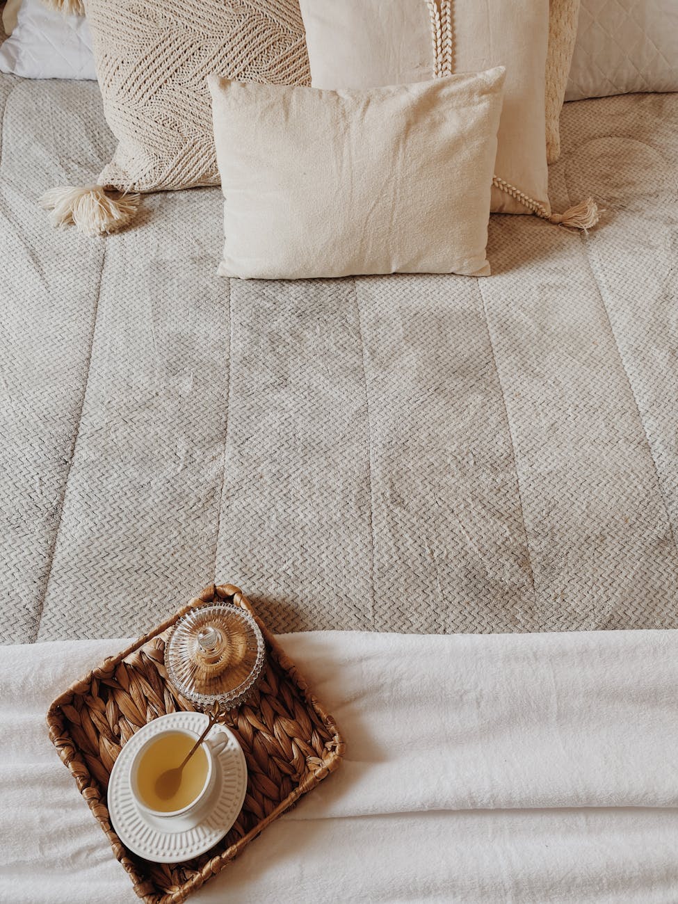 cozy bedroom with tea on woven tray